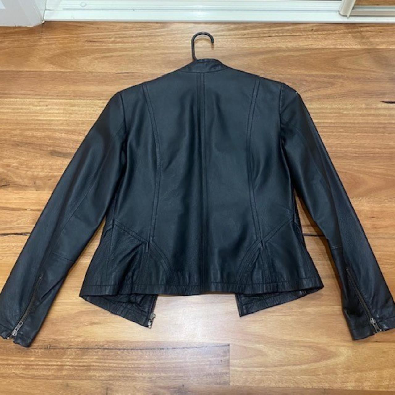 size 8 ladies black leather jacket with zip features... Depop