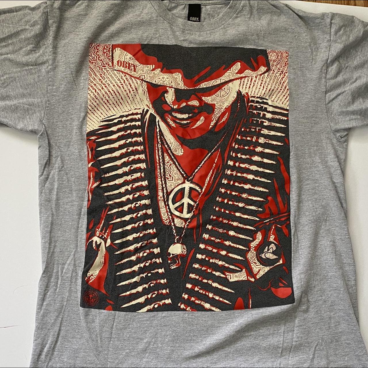 OBEY T-SHIRT - W BLACK & RED GRAPHIC ON FRONT guy... - Depop