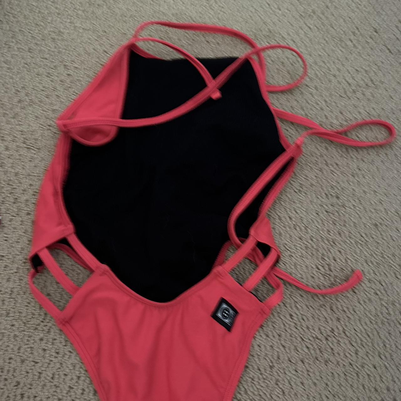 Jolyn Swim Suit. Pinkish Orange color. Tie back.... Depop