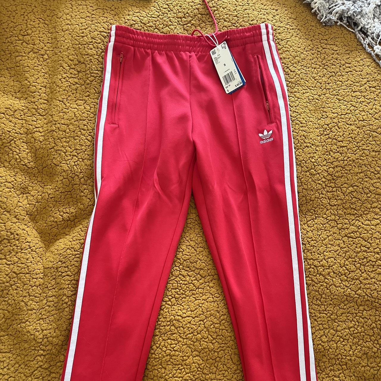 Woman adidas track pants size small in red . Brand... Depop