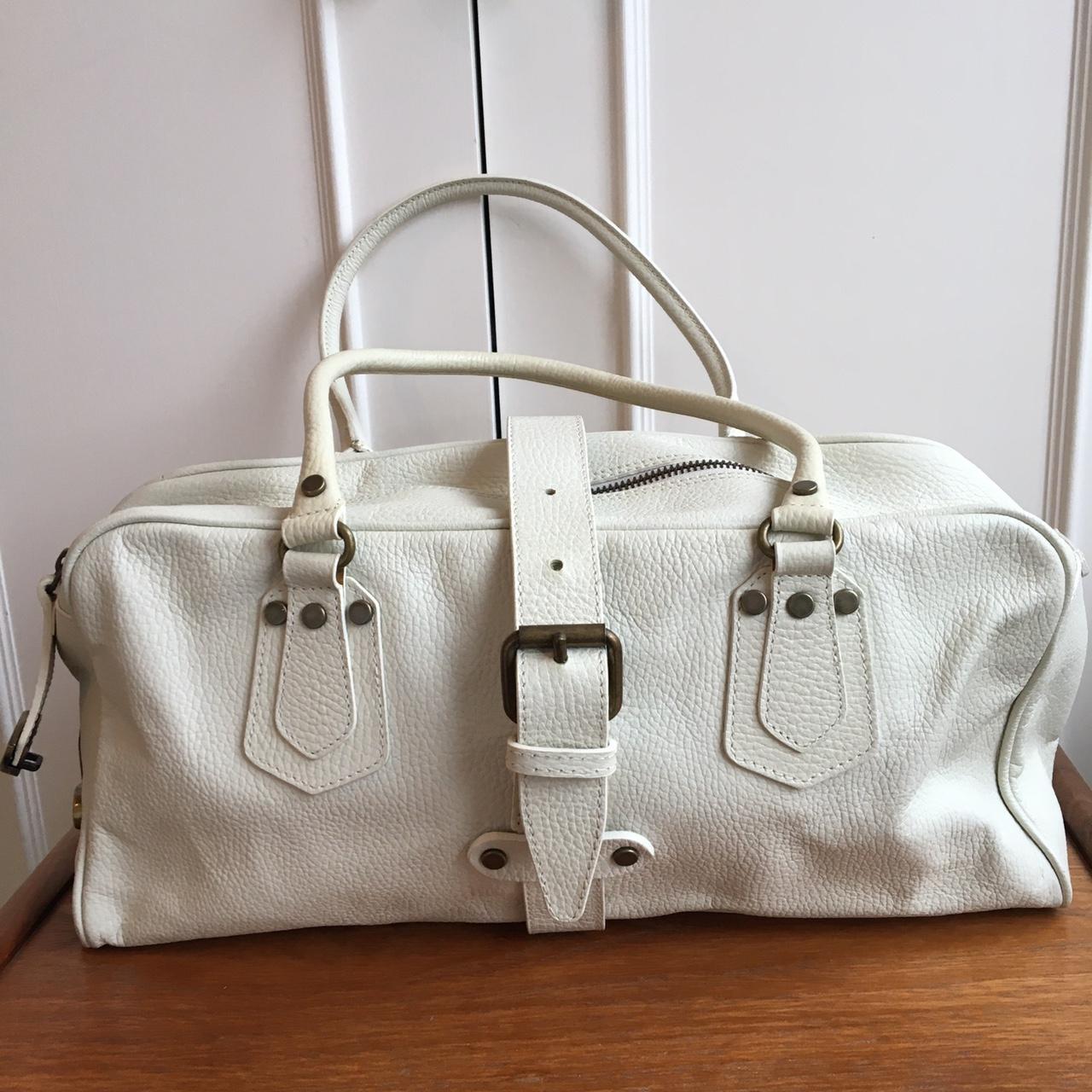 Off white leather handbag. Lockable, key included.... Depop