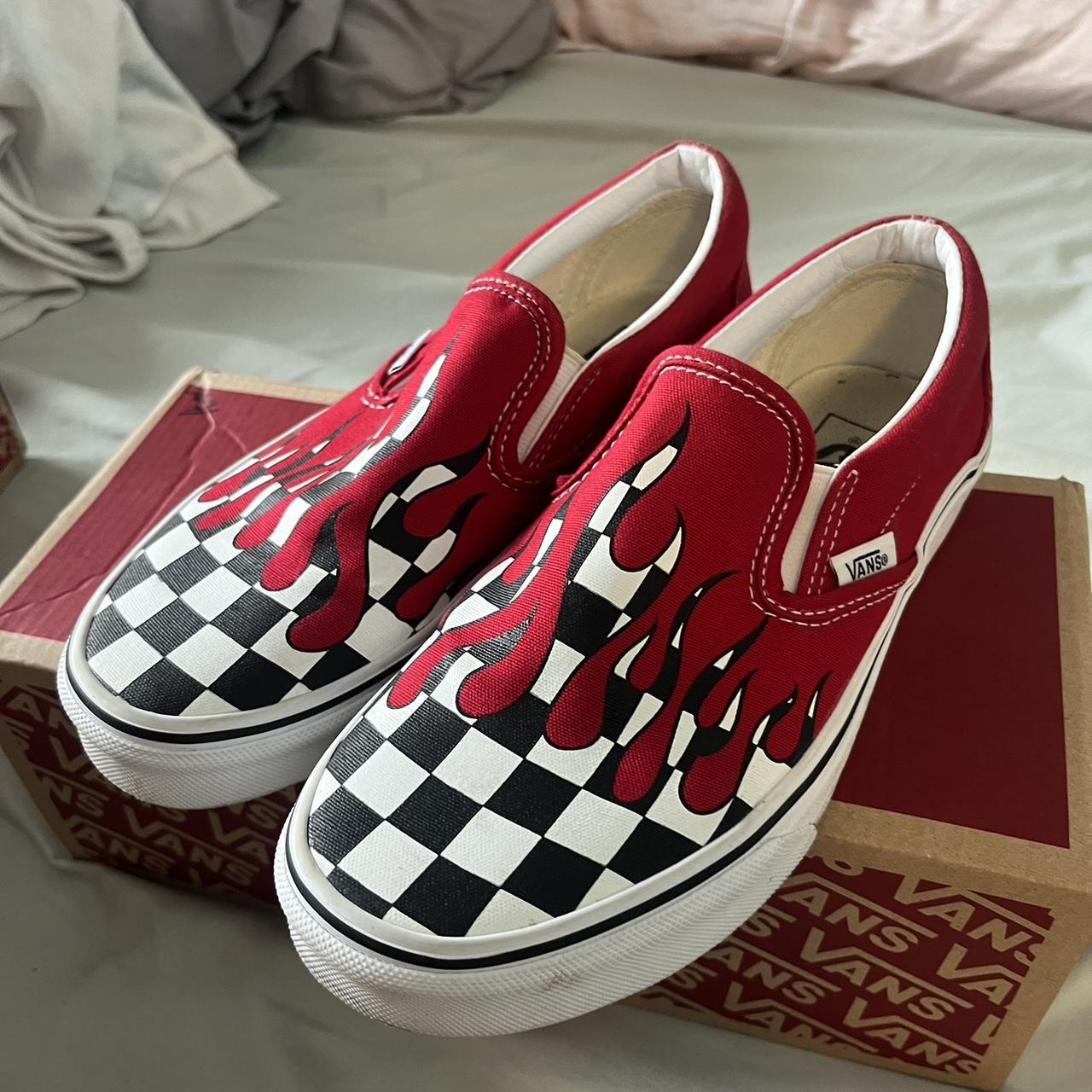 Black and white checkered vans with store red drip