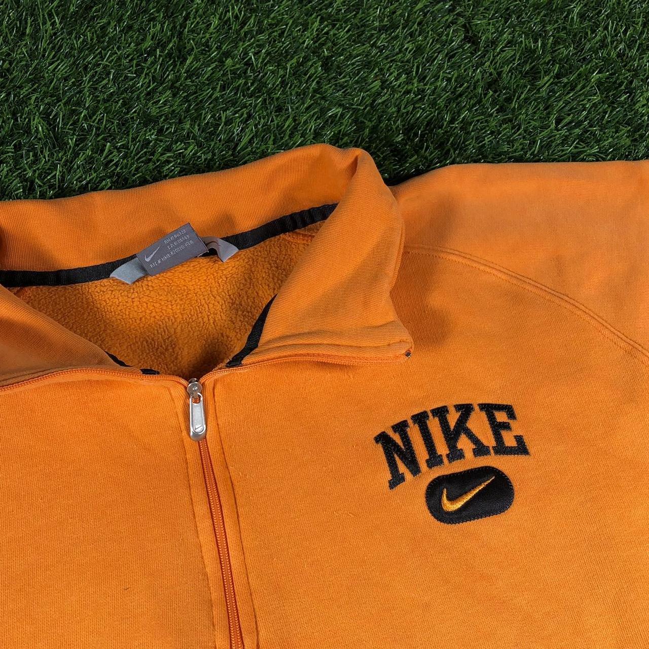 green and orange nike tracksuit