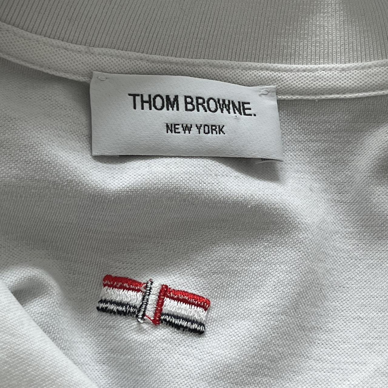 Thom Browne - polo shirt -row of buttons on each... - Depop