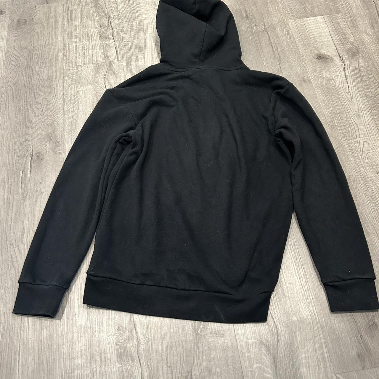 plain black hoodie its medium but can fit a large... - Depop