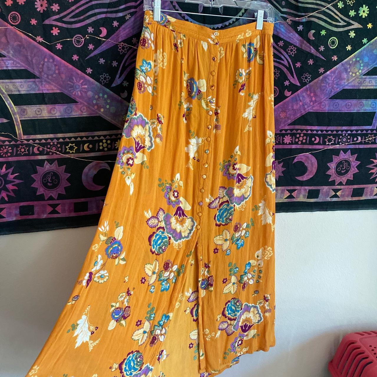 Long and flowy floral skirt with buttons down the... Depop
