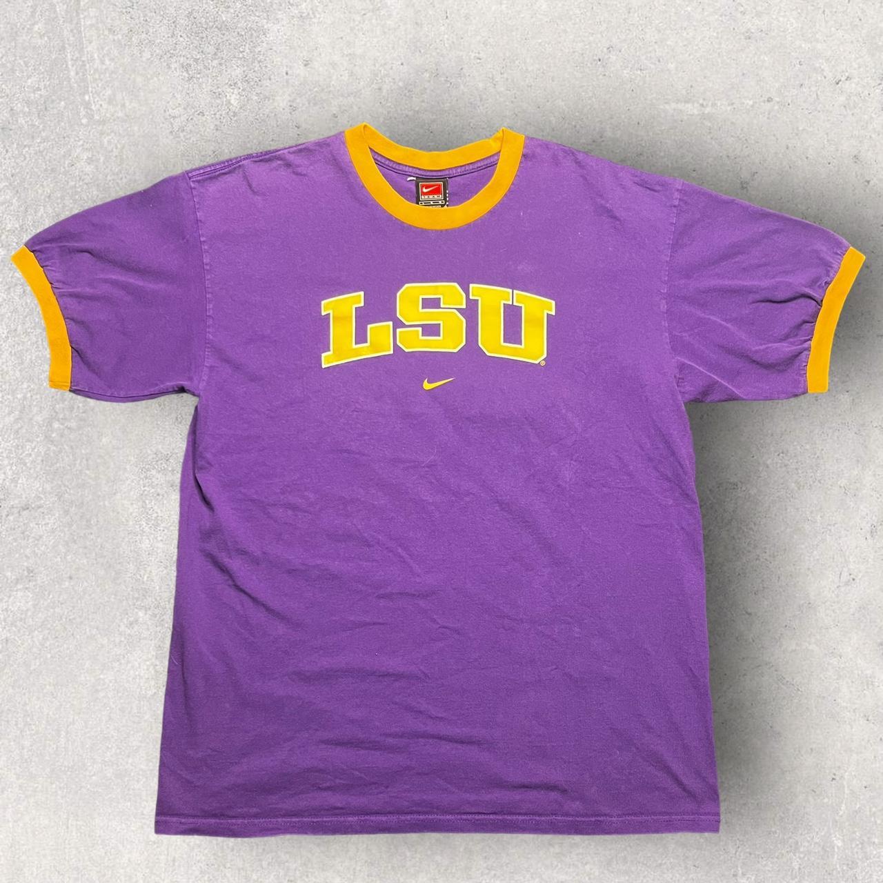 purple and yellow nike shirt