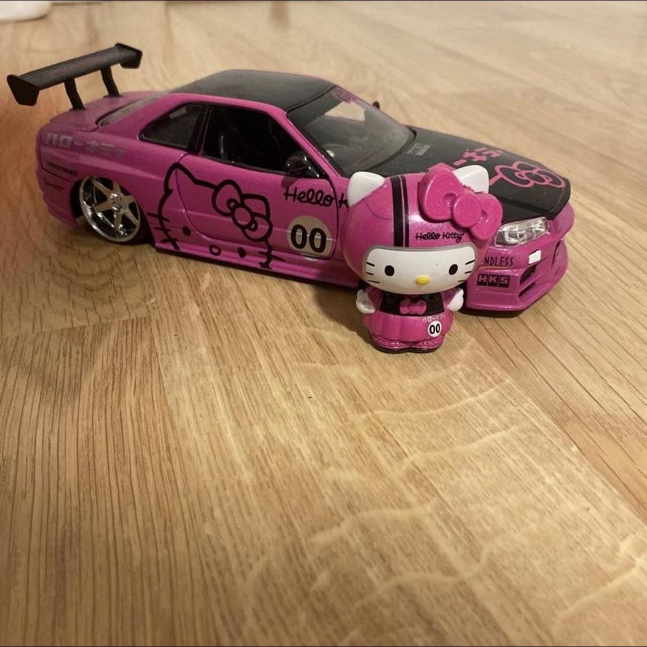 Hello kitty racing car - Depop