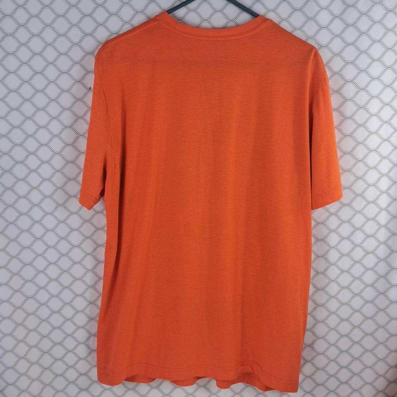 Orange Nike Dri-Fit Orioles t-shirt. The size is an - Depop