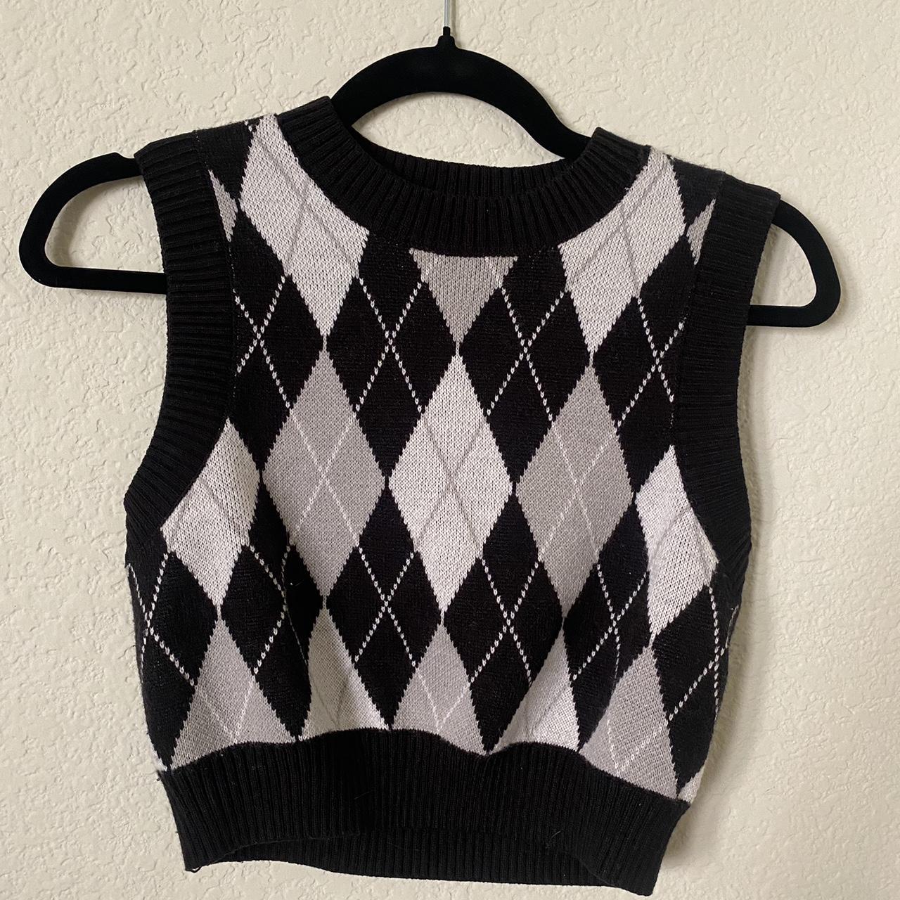 Small black, grey, and white sweater vest from H&M. Depop