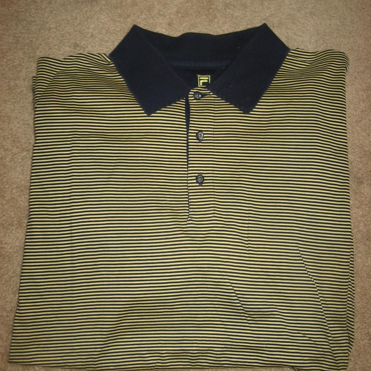 This Mens Navy Gold Striped FILA Cotton Golf Polo... - Depop