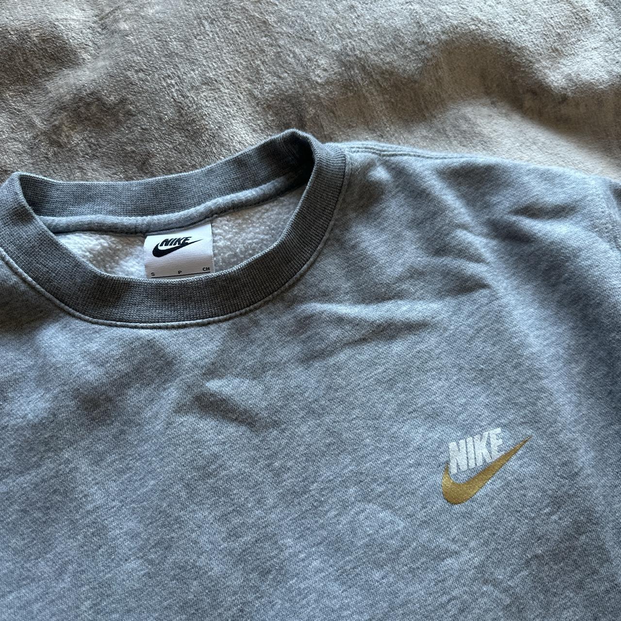 Grey Nike jumper with gold tick Men’s s so women’s... - Depop