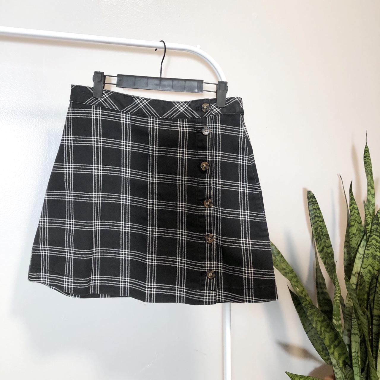 This plaid, A-line skirt can be dressed down with