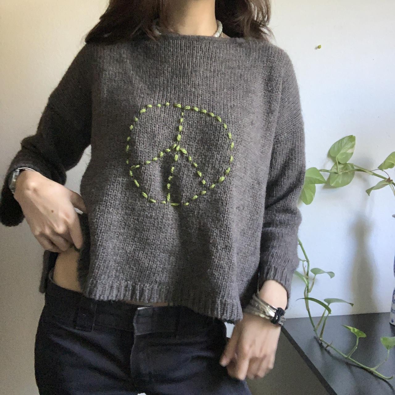 Brown peace sign sweater 🧸 Gray brown base with a... - Depop