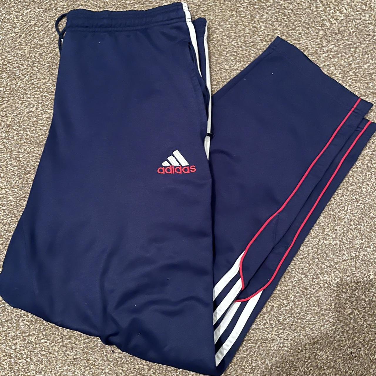Vintage Adidas tracksuit bottoms in navy... Depop