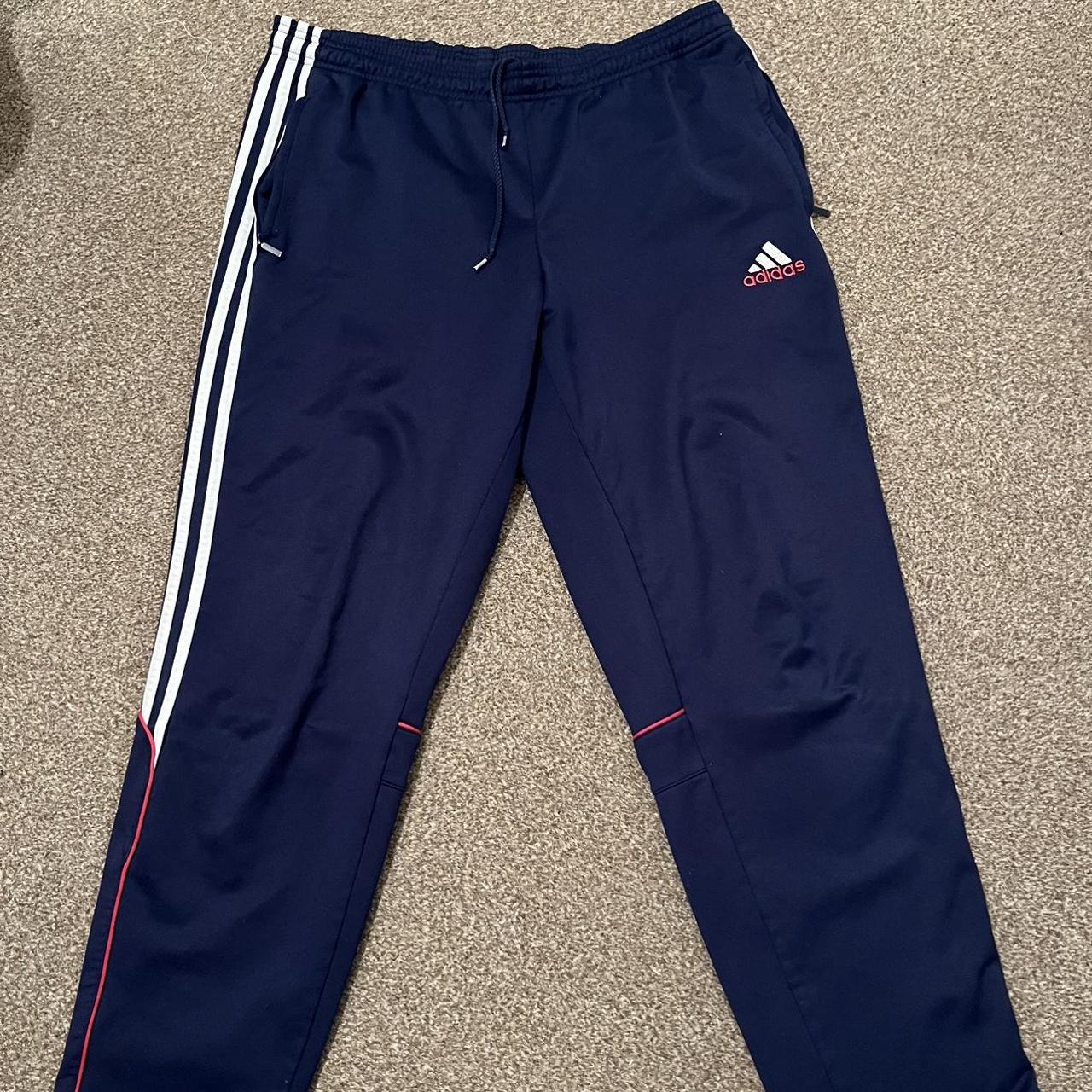 Vintage Adidas tracksuit bottoms in navy... Depop