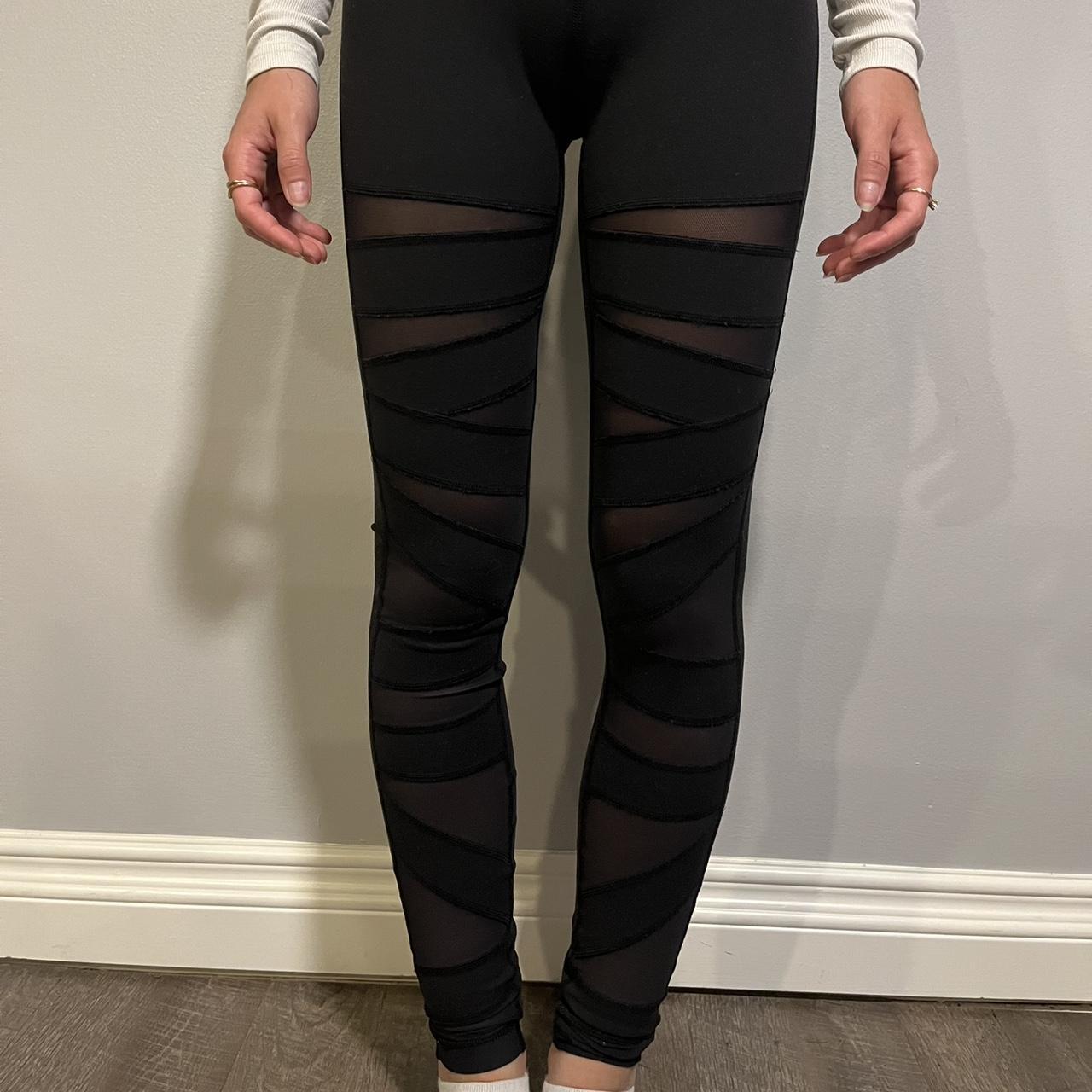 Black leggings with mesh details and mesh cutouts