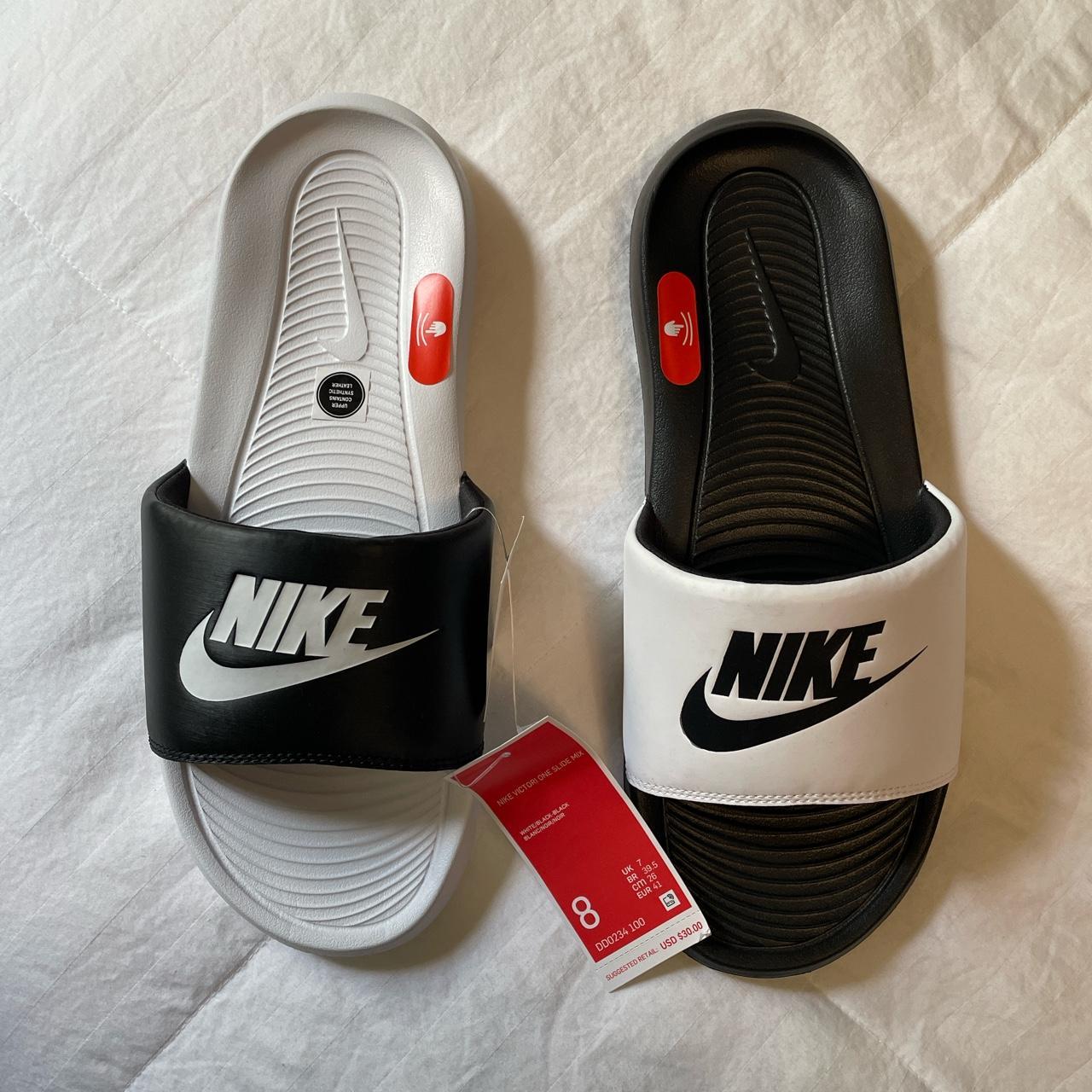 black and white nike flip flops