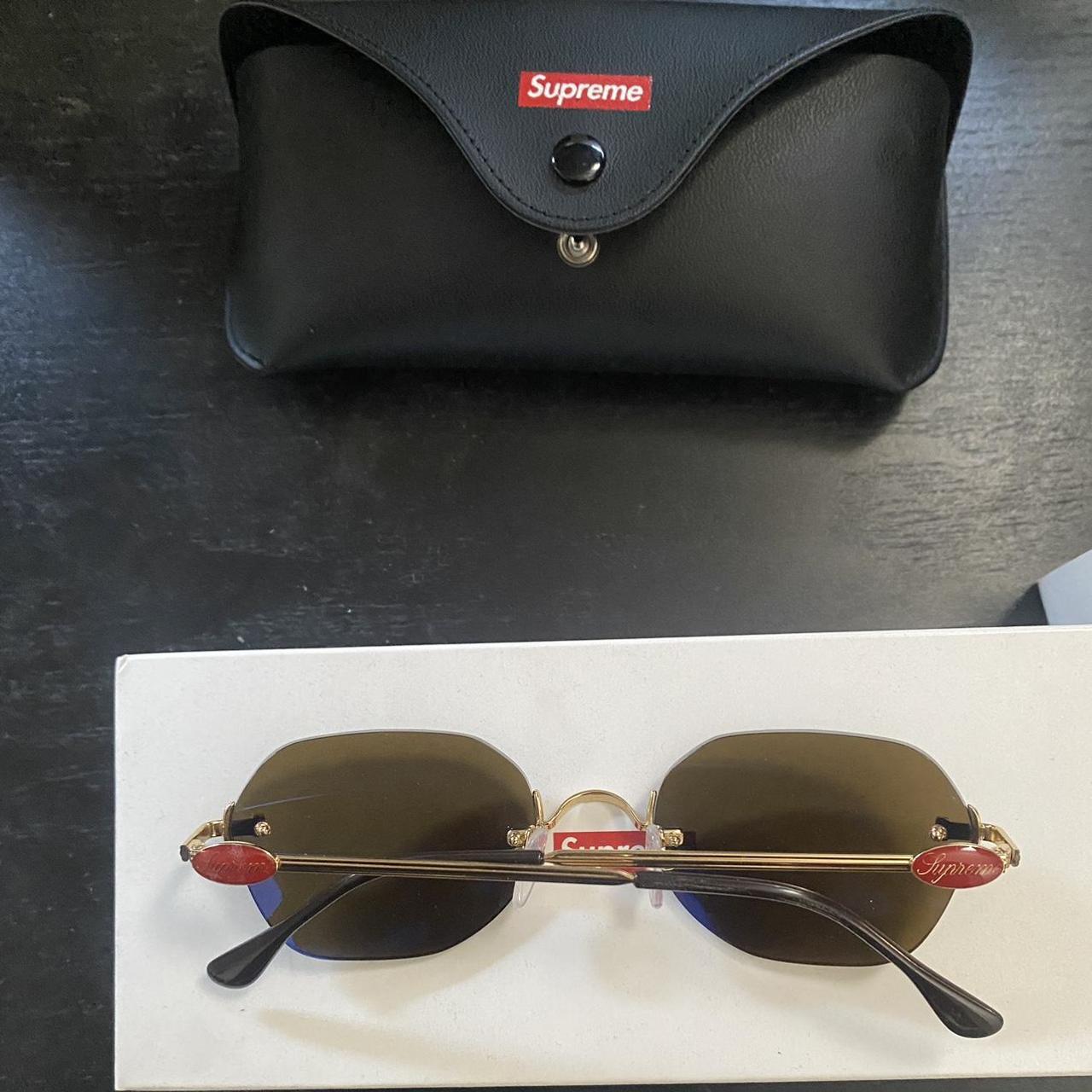 Deadstock Supreme River Sunglasses in gold and...