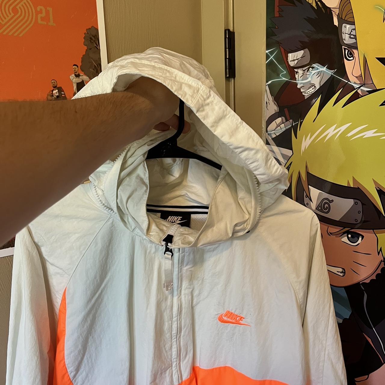 white and orange nike windbreaker