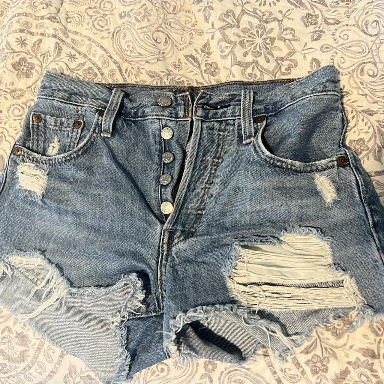 Levi’s denim shorts, ripped on the front and frayed... - Depop