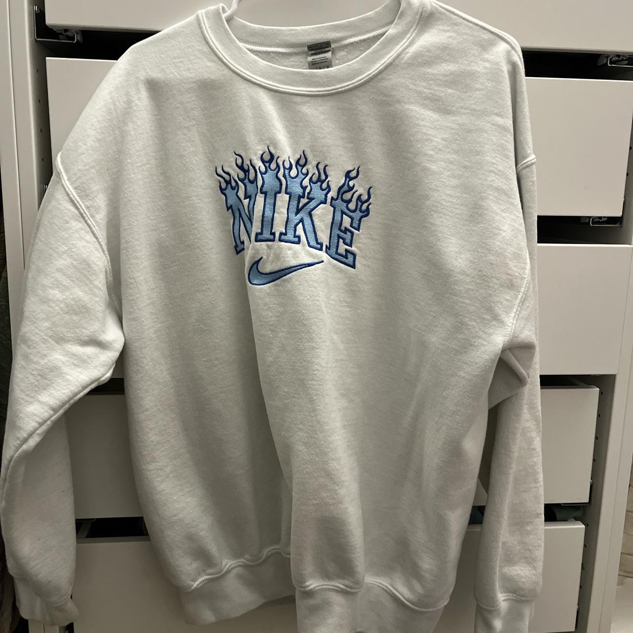 blue and white nike shirt womens