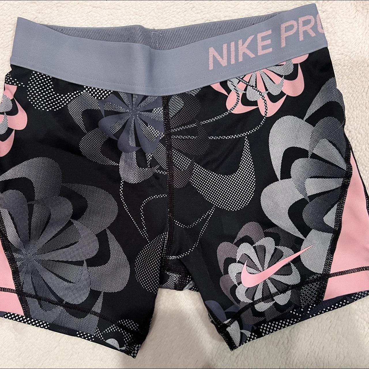 black and pink nike shorts