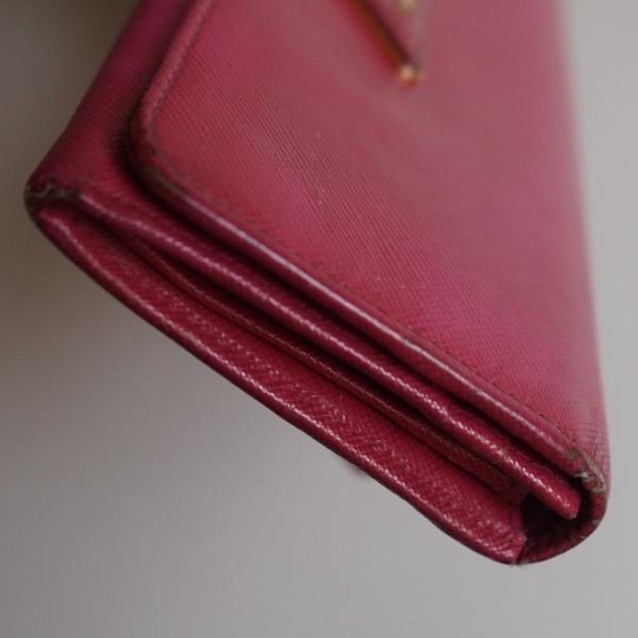 Prada hot pink vintage wallet. Definitely pre loved... Depop
