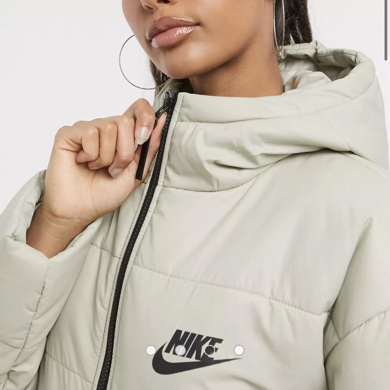 Nike padded jacket with back swoosh in stone,... - Depop