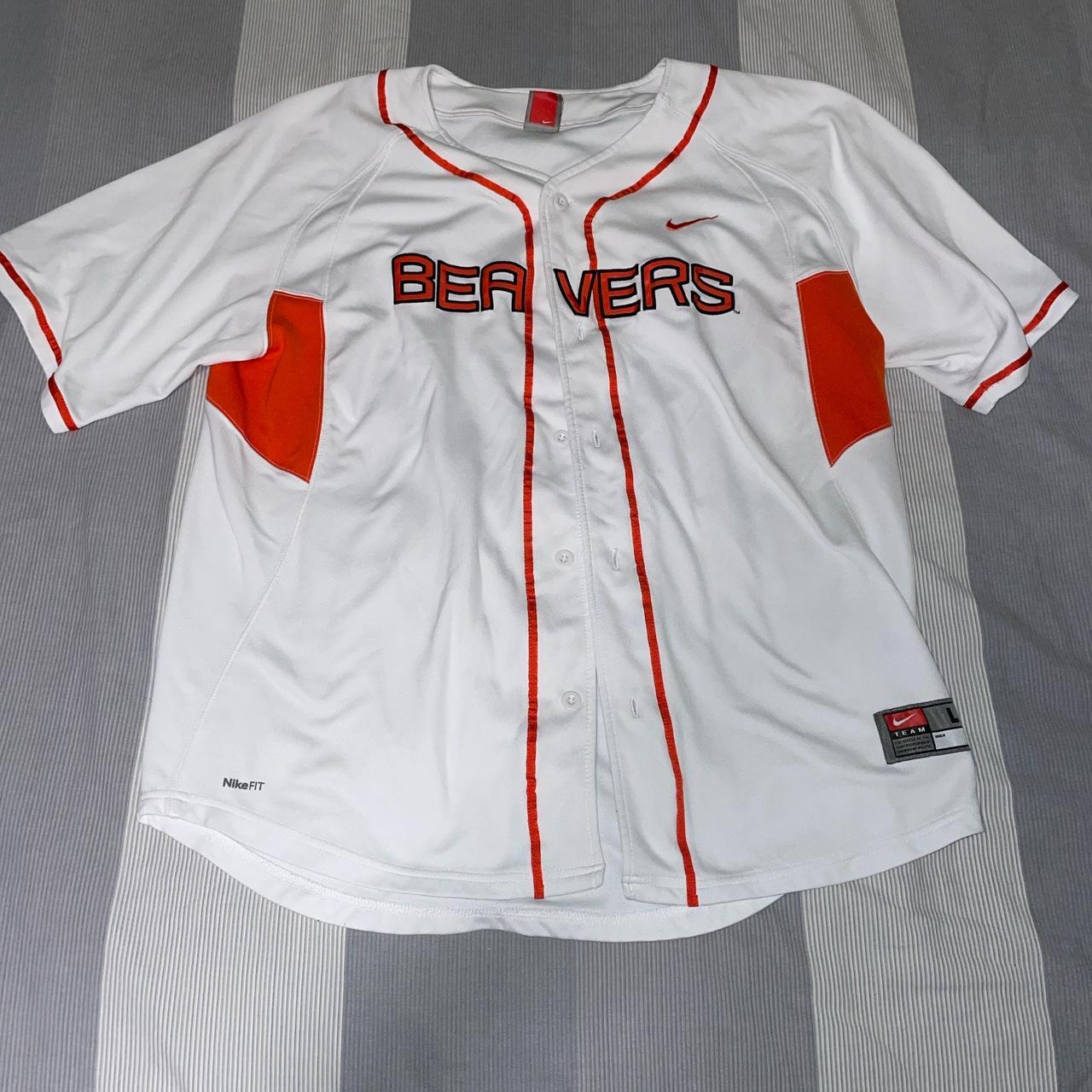 white nike shirt with orange logo