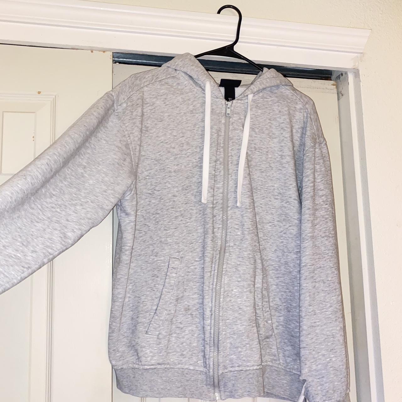 Gray zip up with hoodie, small tear in the arm #grey... - Depop