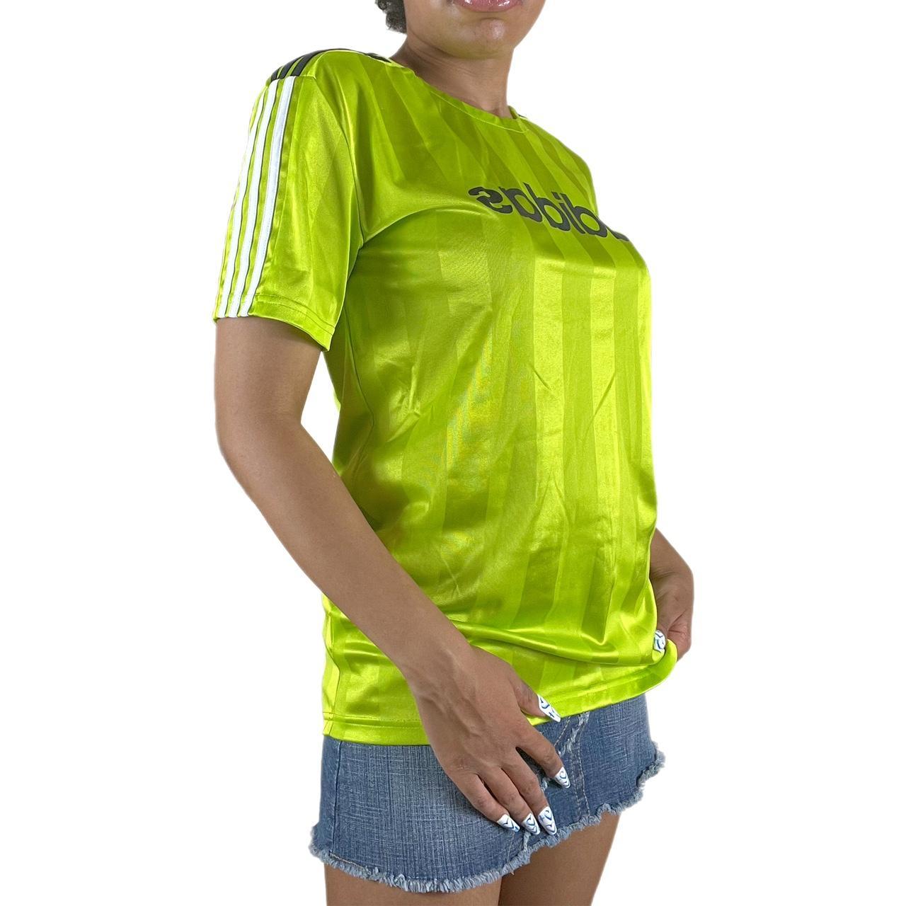 S317 Adidas lime green soccer jersey. Pair with a... Depop