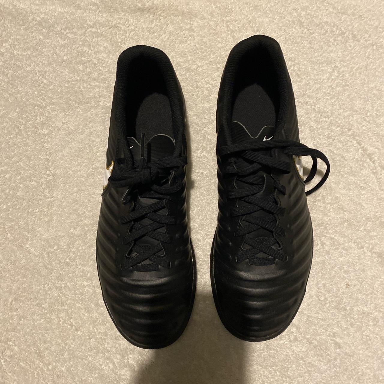 black and gold nike boots