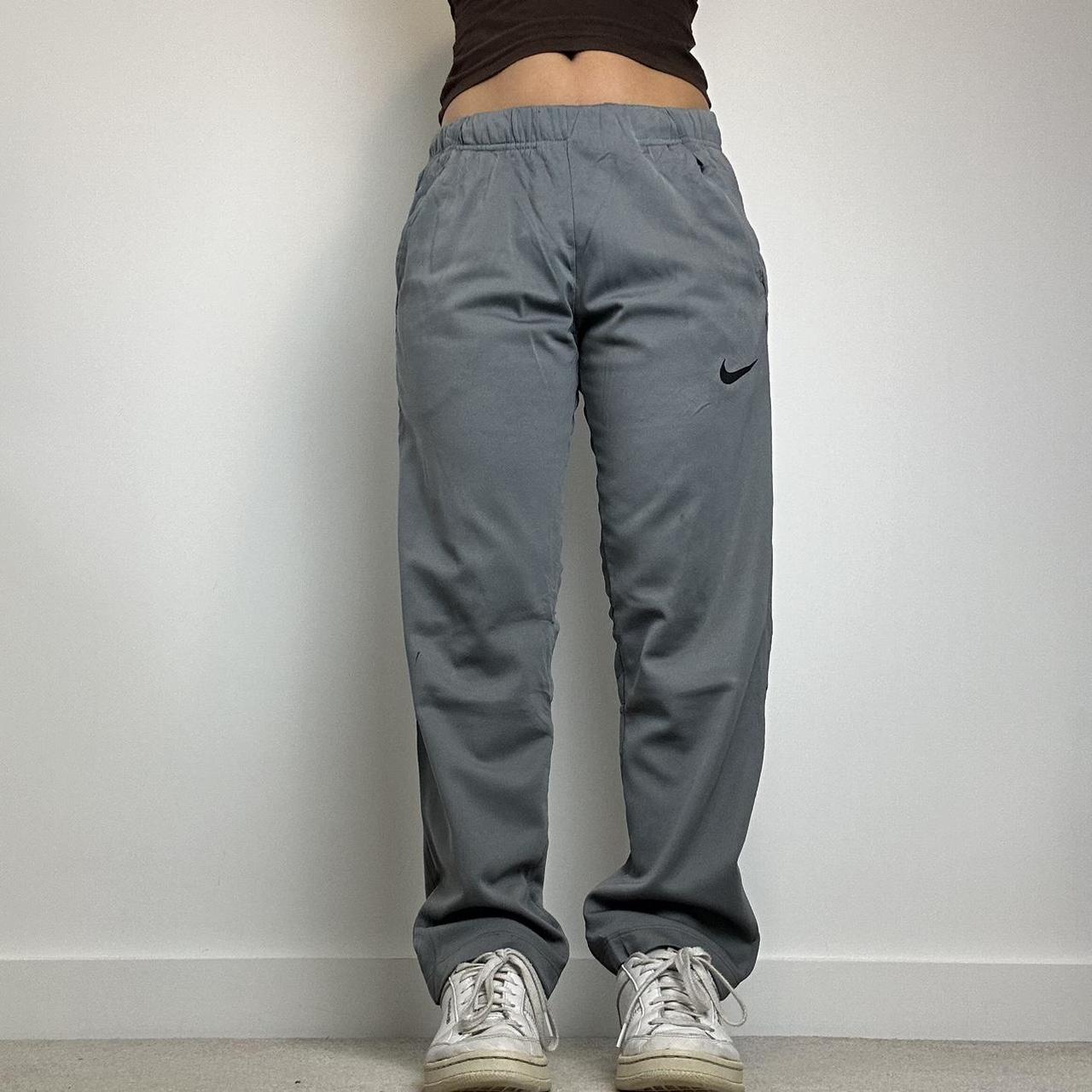 Vintage Nike grey joggers / tracksuit bottoms with... Depop
