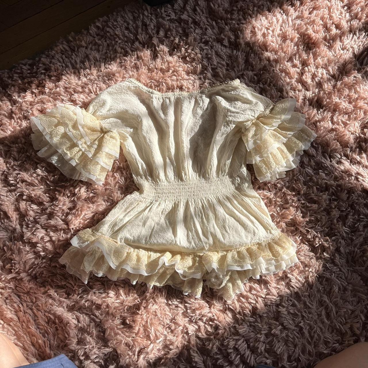 1/1 Cream and black bow top with lace trim Brand is... - Depop