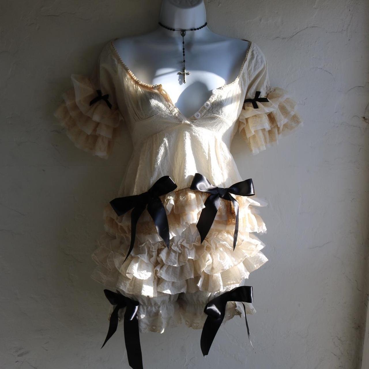 1/1 Cream and black bow top with lace trim Brand is... - Depop
