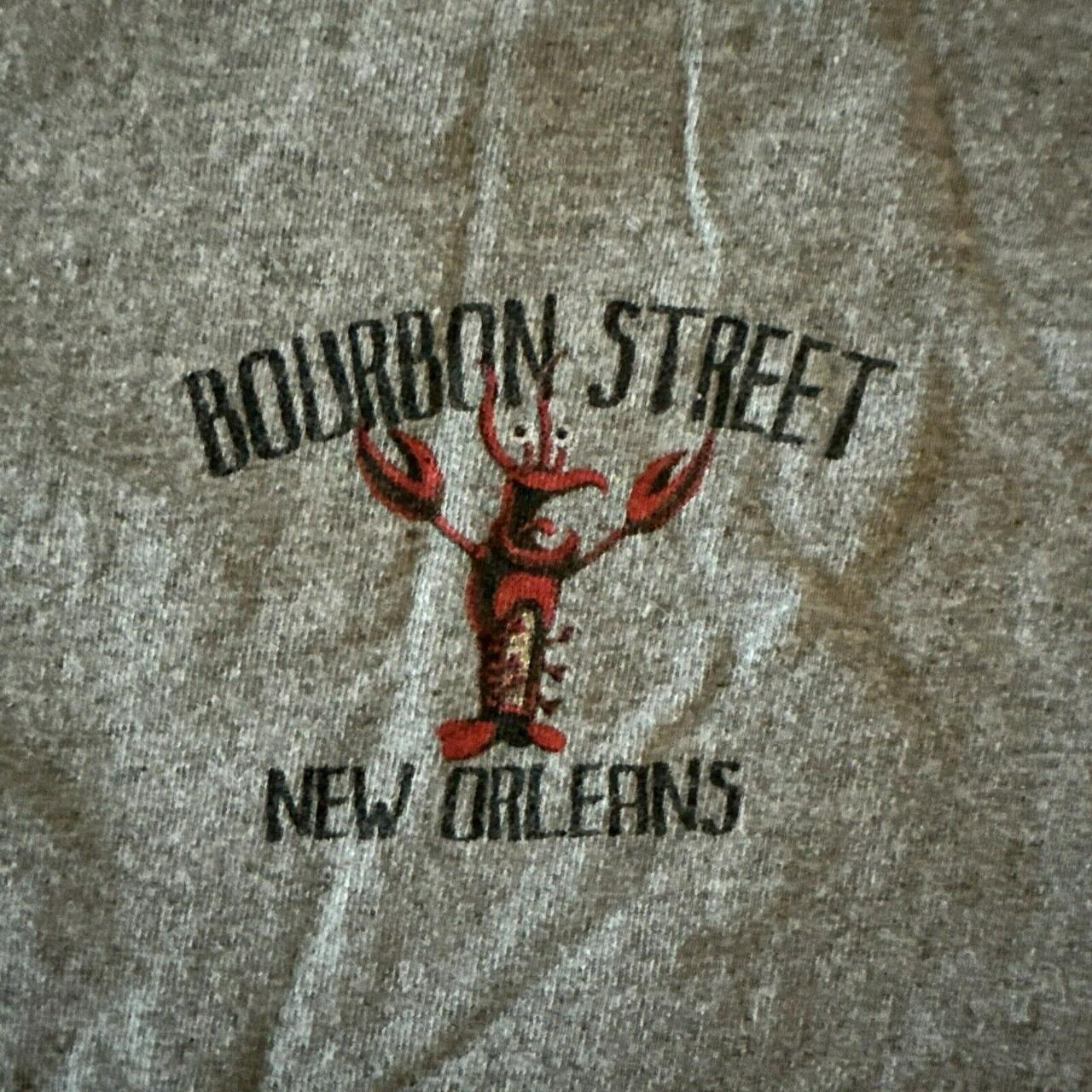 This T-shirt features Bourbon Street in New Orleans,... - Depop