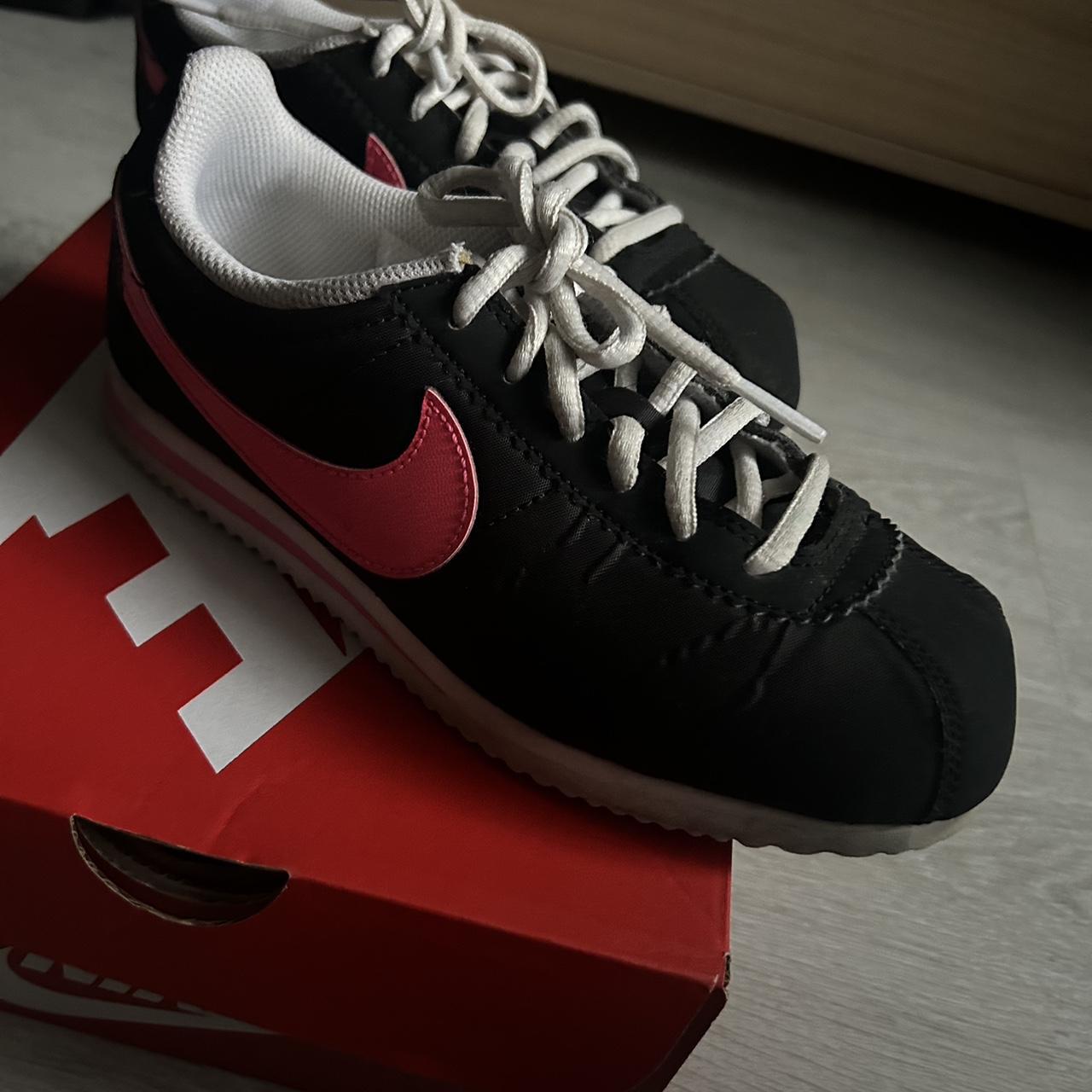 Black and pink nike cortez best sale