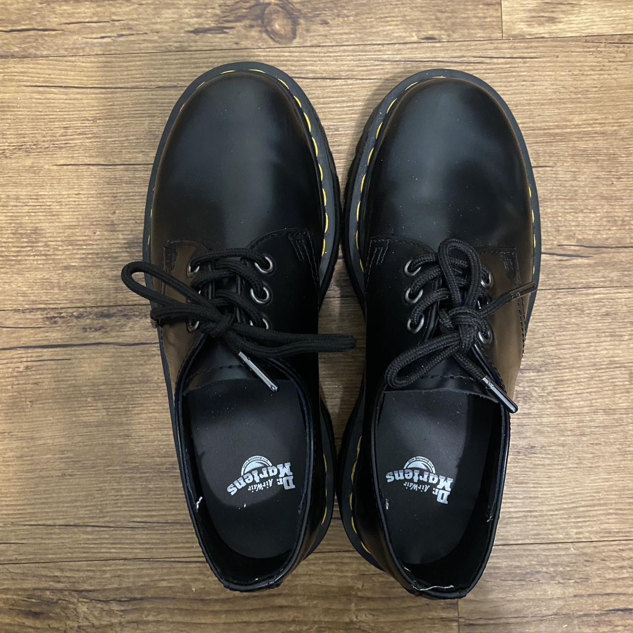 a pair of doc martens, black platform loafers in a... - Depop