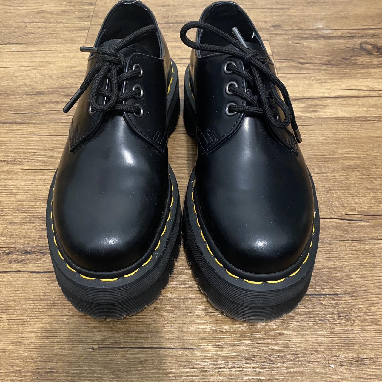 a pair of doc martens, black platform loafers in a... - Depop