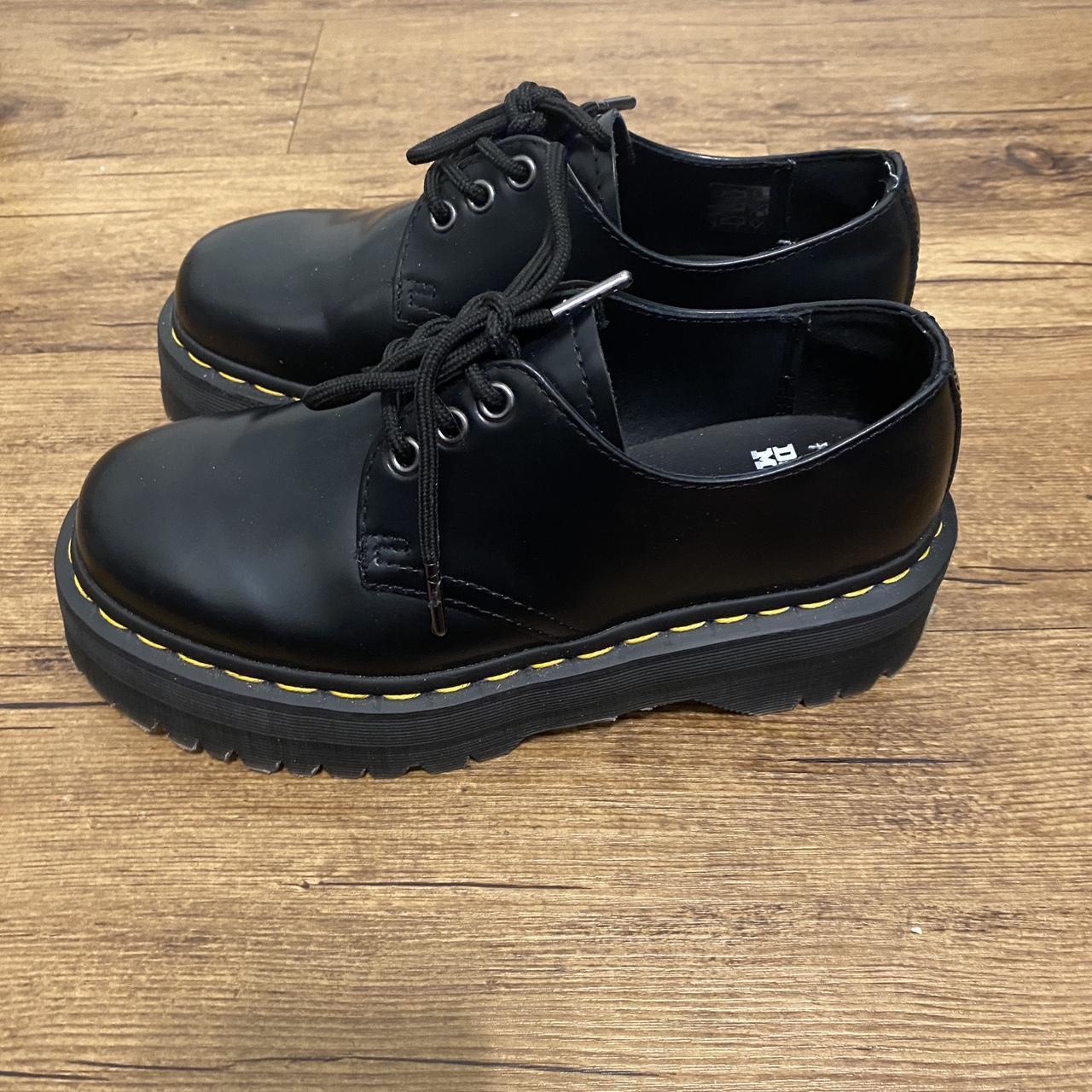 a pair of doc martens, black platform loafers in a... - Depop