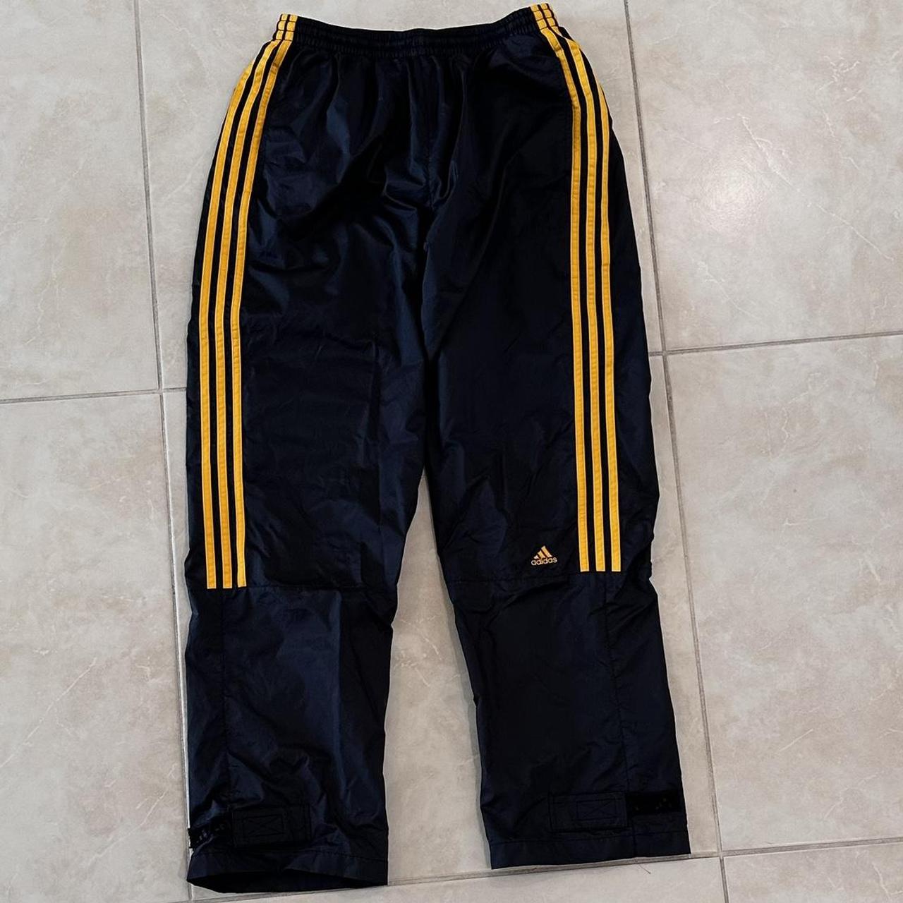 Black and store yellow adidas joggers