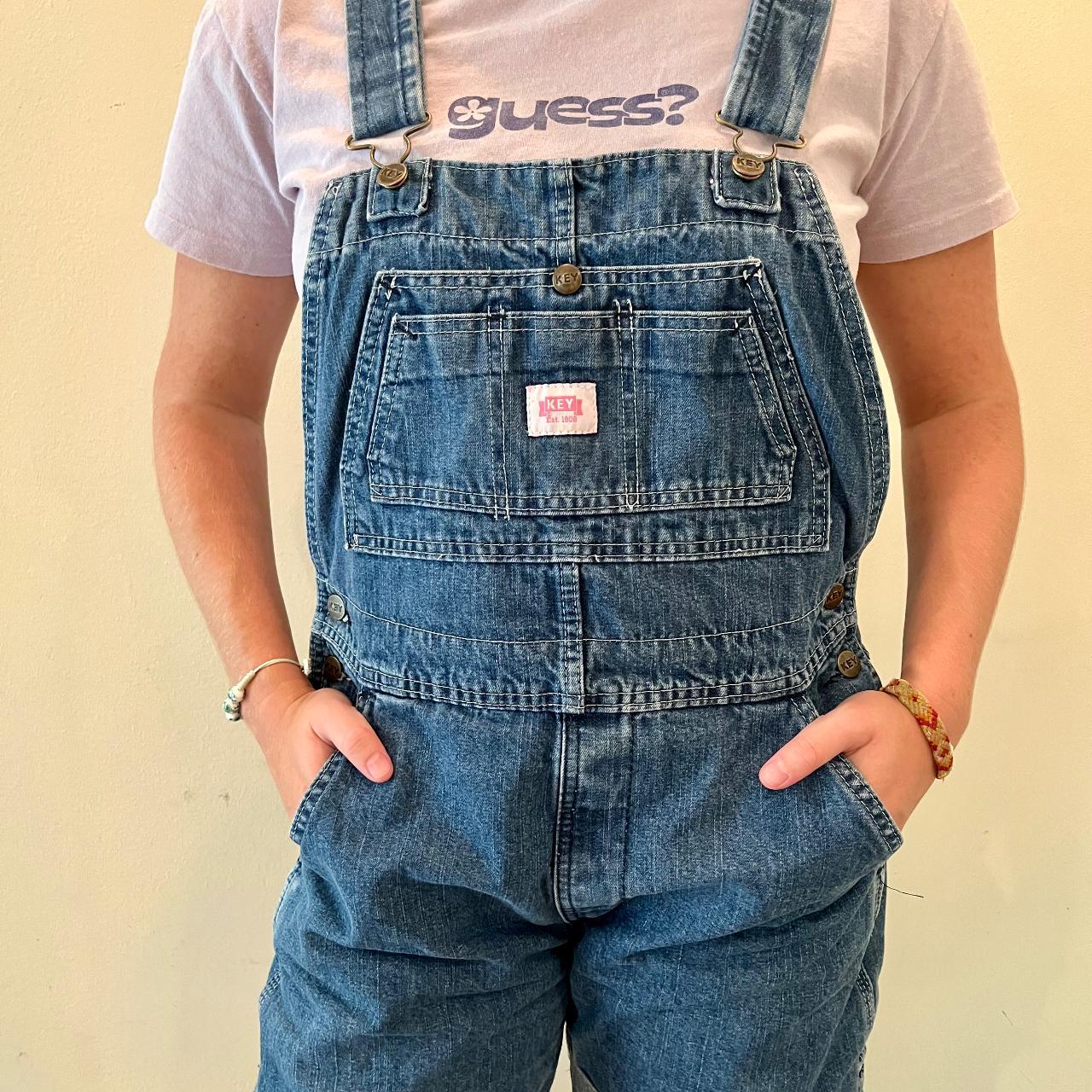 These shortlegged, dark wash Key overalls are... Depop