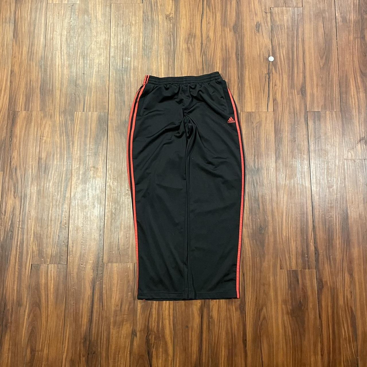 newer adidas track pants black and red size large... Depop