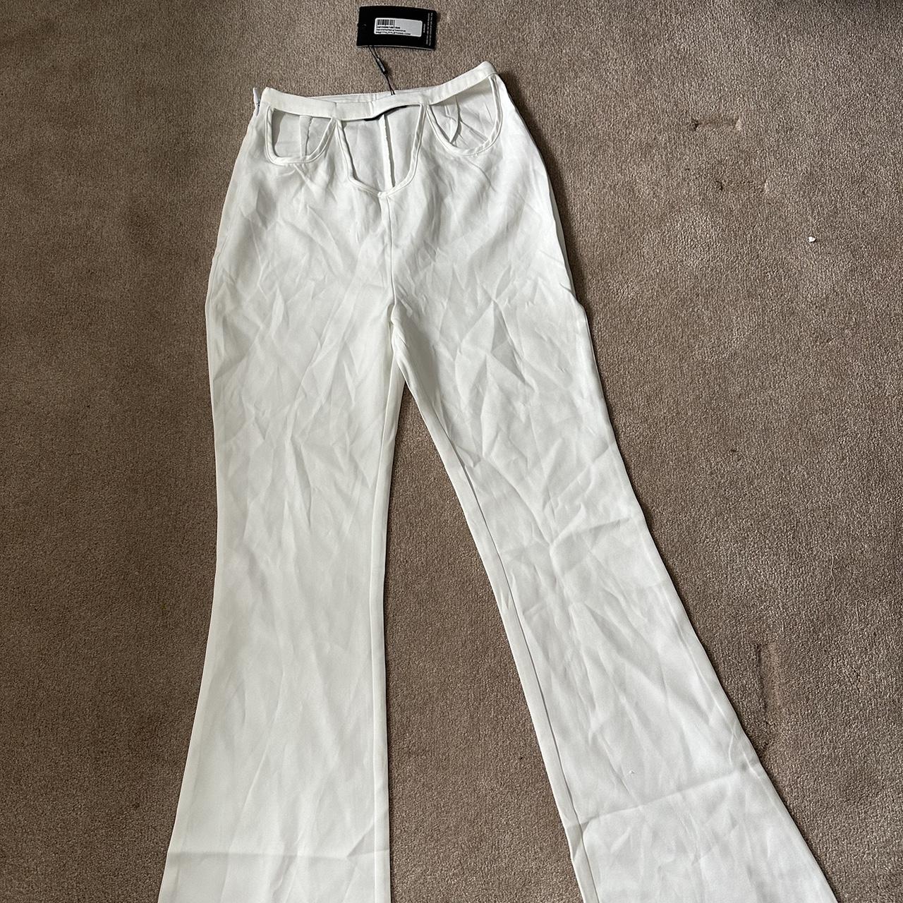 white/cream cut out flared pants never worn super... - Depop