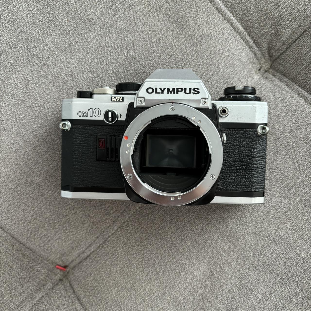 Olympus OM10 film camera (BODY) camera is fully... Depop