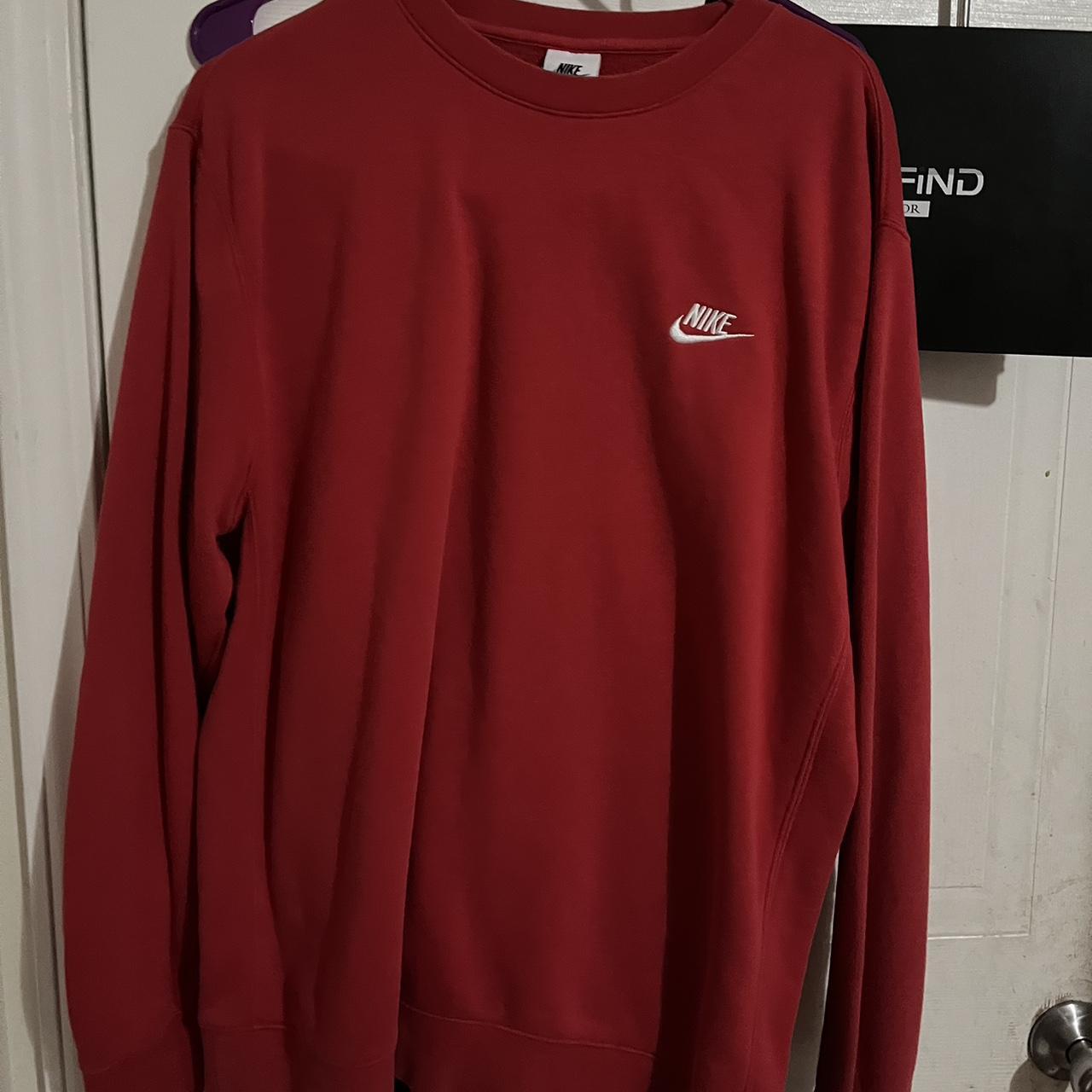 black nike sweatshirt with red tick