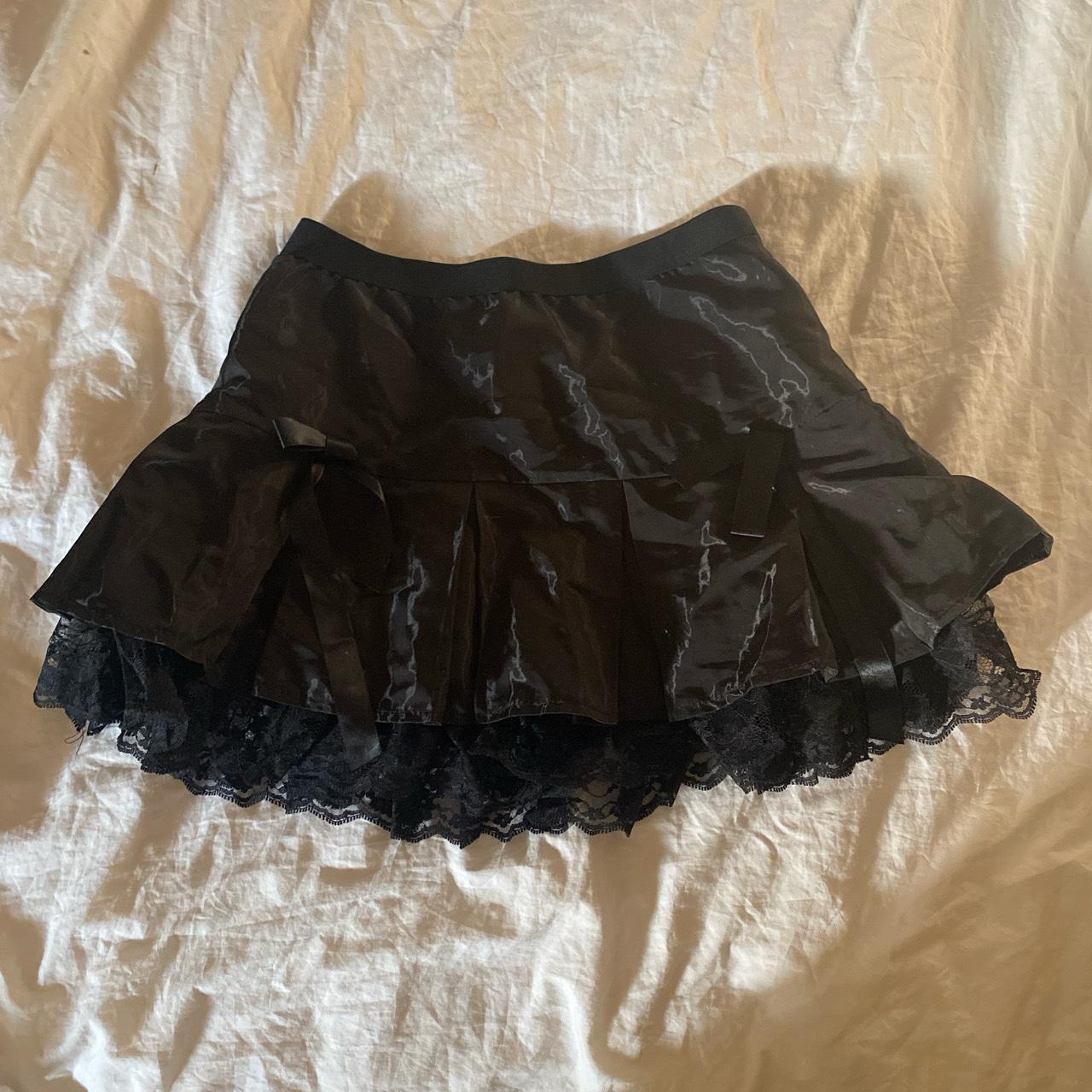 Black skirt with lace underneath, and has little... - Depop