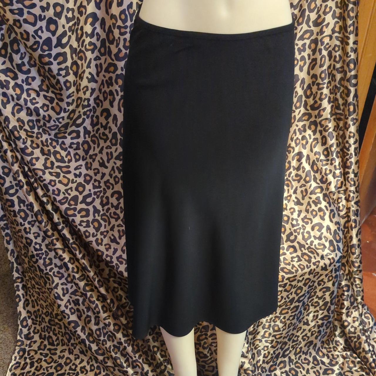 Basics. Simple below the knee black skirt. Good for... Depop