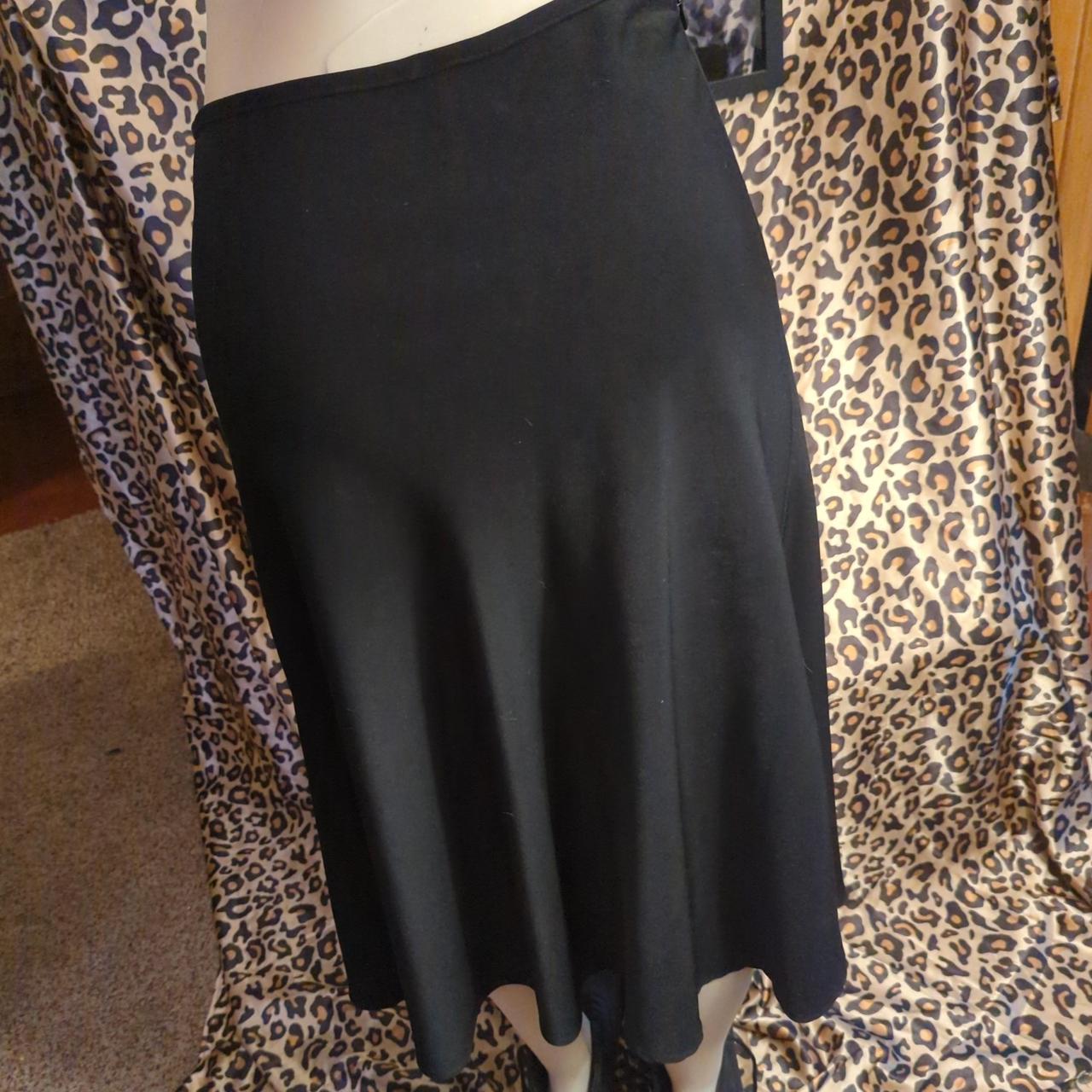 Basics. Simple below the knee black skirt. Good for... Depop